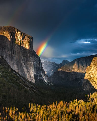 Rainbow over El Capitan and Bridalveil Fall at sunset in Yosemite Valley