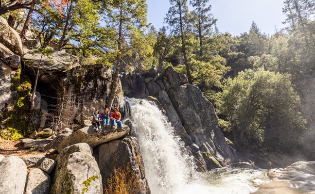 Lower Chilnualna Falls with hikers sitting nearby