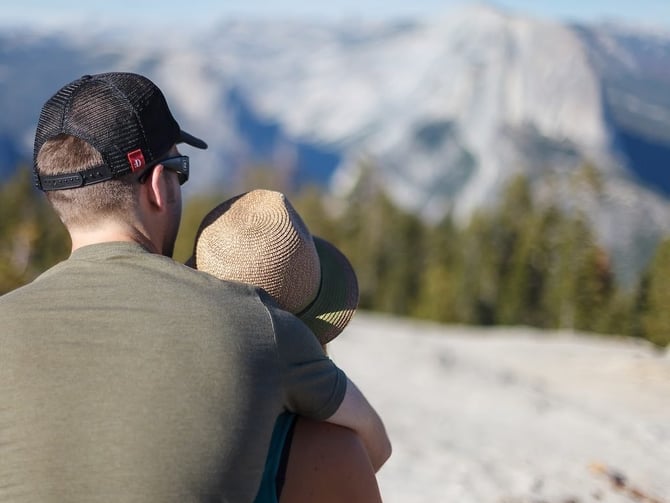 Couple looking out at Yosemite mountains