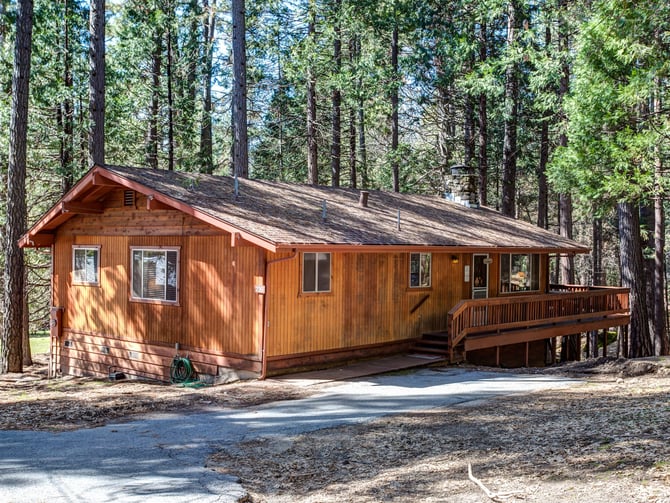 Small cedar cabin with deck in the pines